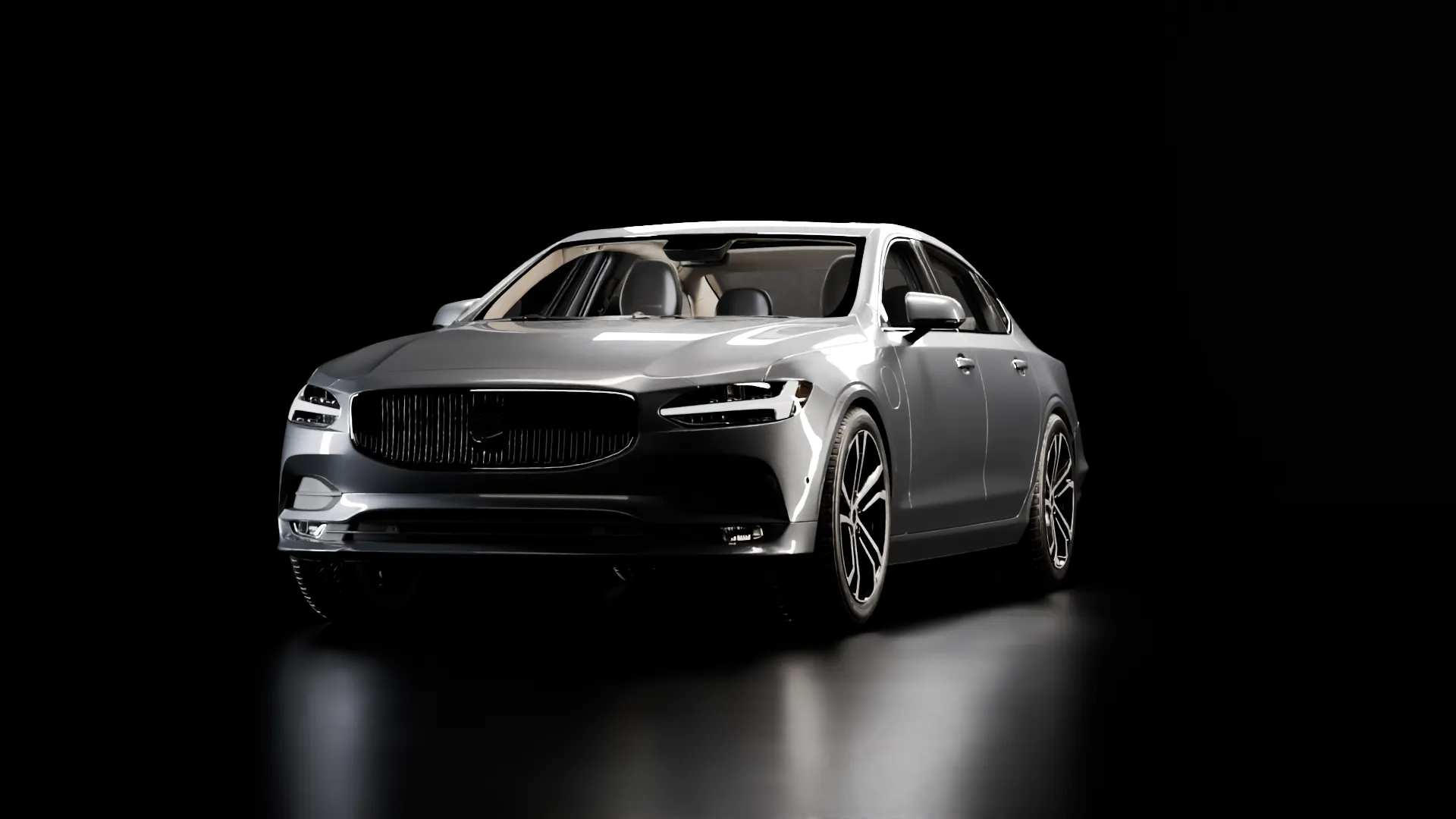 Une berline premium gris argent sous les projecteurs d’un studio plongé dans la nuit